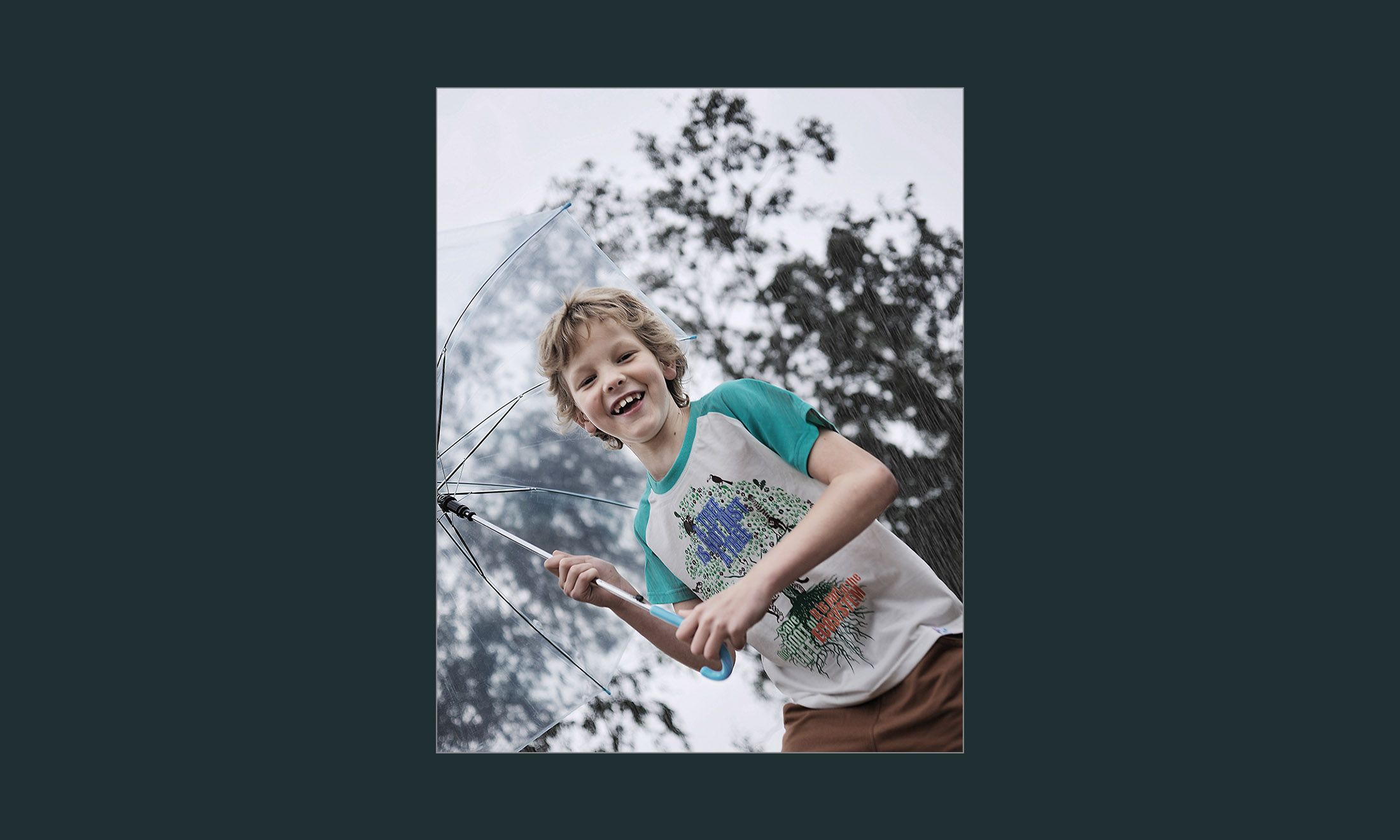 a kid holding umbrella 10